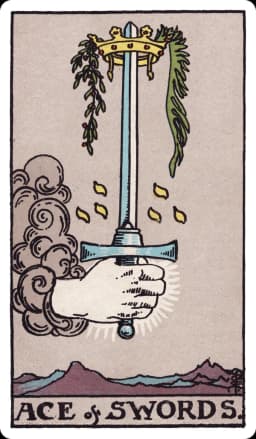 The Ace of Swords from the Rider-Waite-Smith deck: a hand emerges from a cloud gripping a single upright sword, its blade catching light against a stormy grey sky, a golden crown encircling the tip with a sprig of palm and olive draped from it, jagged snow-capped mountains visible in the far distance below.