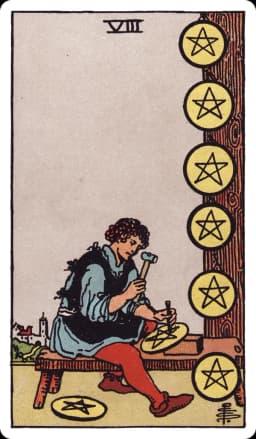 The Eight of Pentacles from the Rider-Waite-Smith deck: a craftsman sits on a wooden bench carving a pentacle into a stone disc, six finished pentacles already mounted on a post and wall beside him, tools scattered at his feet, a small distant town visible beyond the workshop.