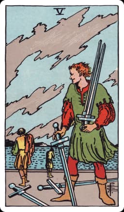 The Five of Swords from the Rider-Waite-Smith deck: a smirking man in the foreground gathers three swords into his arms while two more lie discarded on the ground at his feet, two defeated figures walk away in the distance with heads bowed and shoulders slumped, a turbulent, wind-streaked sky stretching overhead.