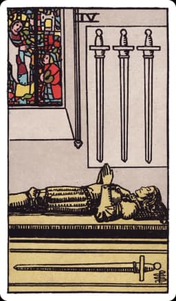 The Four of Swords from the Rider-Waite-Smith deck: a stone effigy of a knight lies still atop a tomb inside a quiet chapel, hands folded in prayer, three swords mounted on the wall above point downward while a fourth lies horizontal beneath the tomb, a stained-glass window glowing behind him.