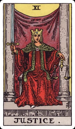 Justice from the Rider-Waite-Smith deck: a crowned figure in a red robe sits enthroned between two grey pillars, holding an upright double-edged sword in the right hand and a set of balanced scales in the left, a square clasp fastening the robe at the throat.