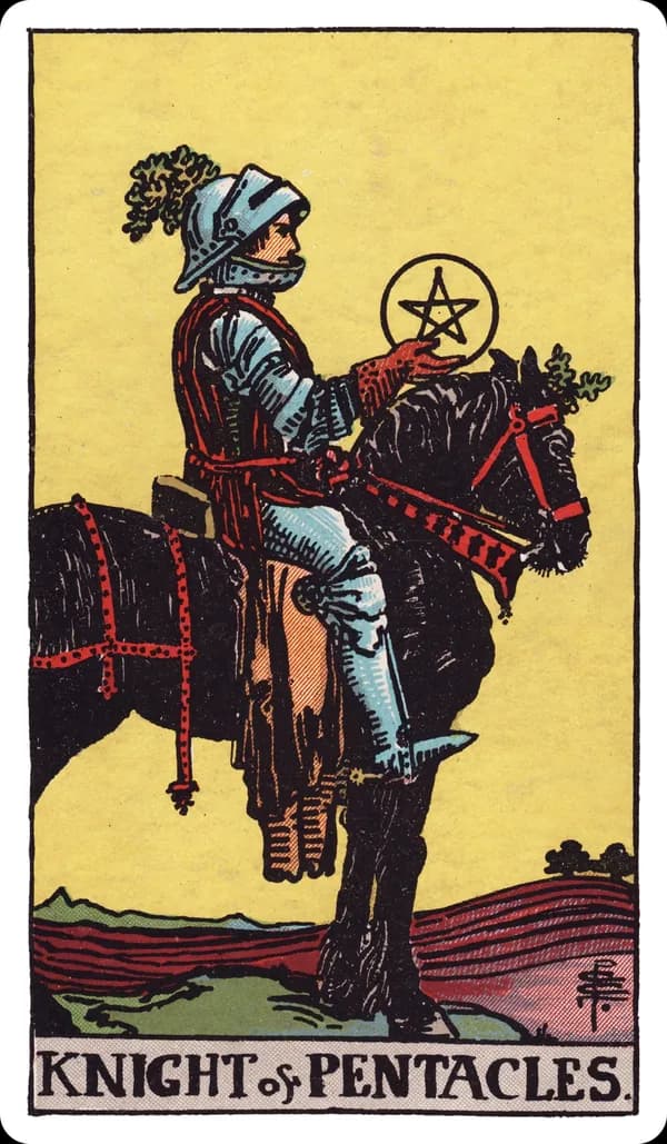 The Knight of Pentacles from the Rider-Waite-Smith deck: an armored knight sits motionless on a stationary black workhorse in a freshly plowed field, holding a pentacle in one raised hand and looking steadily at it, distant plowed rows stretching toward the horizon.