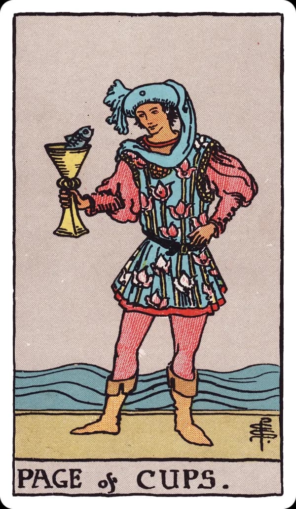 The Page of Cups from the Rider-Waite-Smith deck: a young figure in a flowing, flower-patterned tunic stands at the water's edge, holding up a golden cup from which a fish pops its head out; the figure gazes at the fish with open curiosity, waves rolling gently behind.