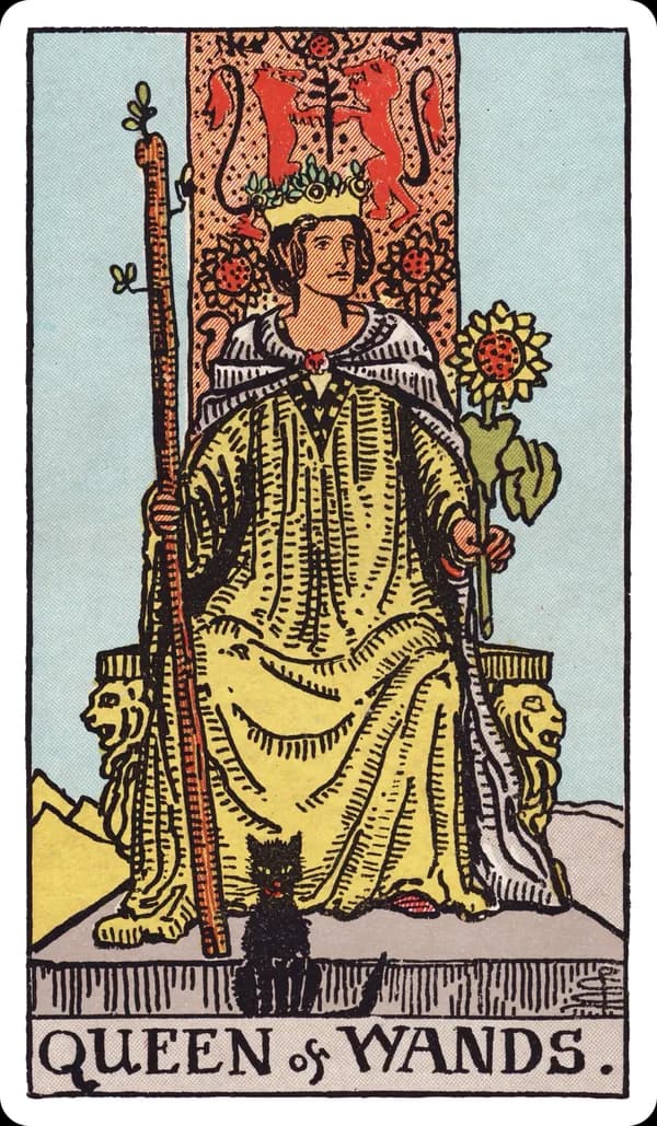 The Queen of Wands from the Rider-Waite-Smith deck: a queen sits facing forward on a throne carved with lions and sunflowers, holding a tall budding wand in one hand and a sunflower in the other, a black cat seated calmly at her feet, sunlight filling the desert scene behind her.