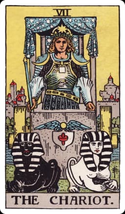 The Chariot from the Rider-Waite-Smith deck: an armored figure stands within an open stone chariot beneath a canopy of stars, crescent moons on each shoulder, holding a wand rather than reins, drawn by two sphinxes — one black, one white — seated at rest before him, with a walled city visible in the background.