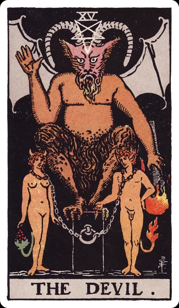 The Devil from the Rider-Waite-Smith deck: a horned, half-goat figure with bat wings sits on a black cube pedestal, an inverted pentagram glowing on its forehead, holding a downward-pointing torch, while a naked man and woman stand chained loosely at the pedestal's base, their chains visible but slack enough to remove, small tails — one ending in fire, one in grapes — visible behind them.