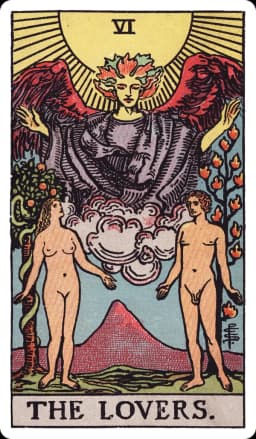 The Lovers from the Rider-Waite-Smith deck: a naked man and woman stand in a garden beneath a radiant sun, a winged angel emerging from clouds above them with arms outstretched in blessing, a tree bearing twelve flames rising behind the man, and a tree with a coiled serpent behind the woman, a large mountain visible in the far distance between them.