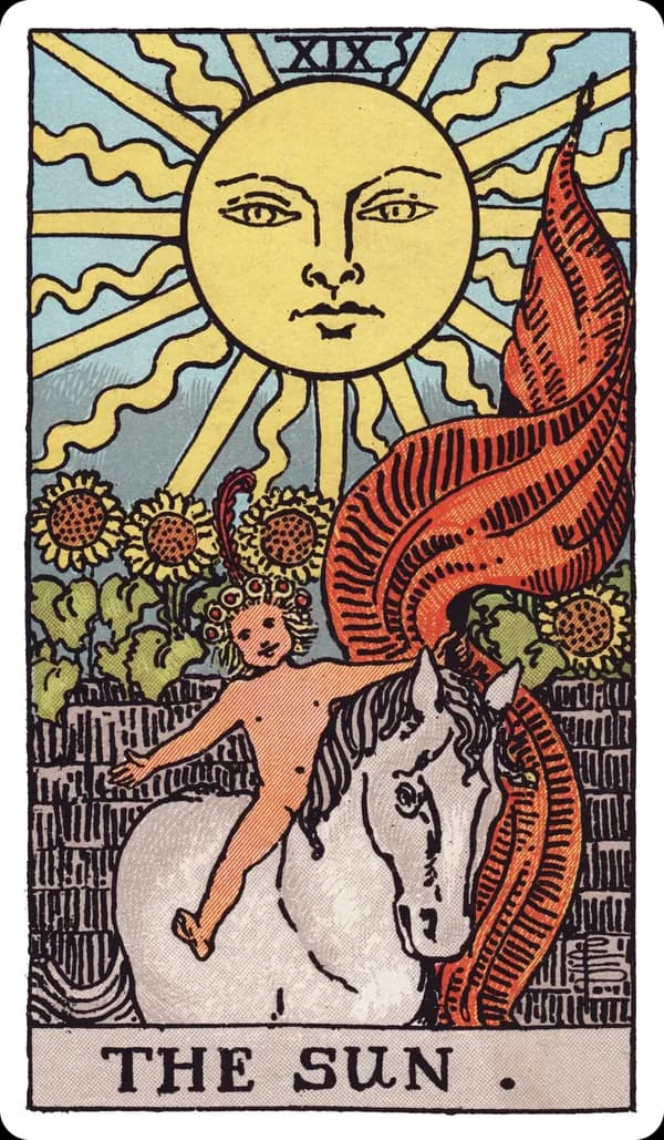 The Sun from the Rider-Waite-Smith deck: a radiant sun with a human face shines directly overhead, a naked child rides a white horse bareback beneath it, arms outstretched and a red banner streaming behind, four sunflowers bloom over a low garden wall in the background.