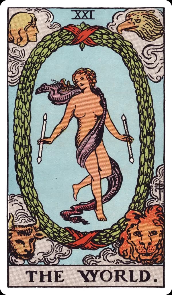 The World from the Rider-Waite-Smith deck: a lightly draped dancing figure holds a wand in each hand at the center of an oval laurel wreath bound top and bottom with red ribbon, her legs crossed at the shin; in the four corners outside the wreath, a winged human figure, an eagle, a bull, and a lion each look inward.