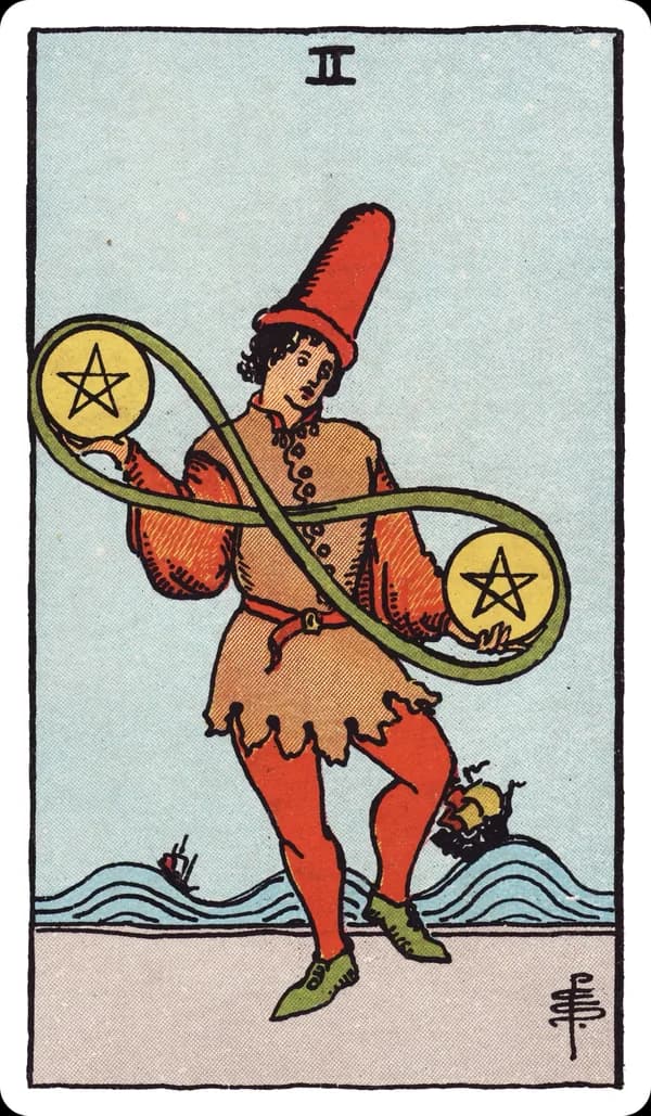 The Two of Pentacles from the Rider-Waite-Smith deck: a young figure in a jester-like cap dances on a shoreline, juggling two pentacles joined by a green ribbon looped into a lemniscate, while two ships ride large swelling waves in the background.